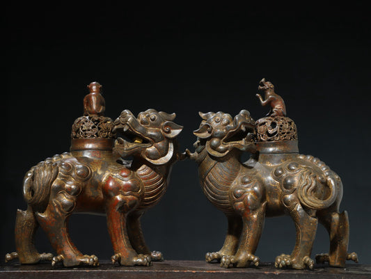 A pair of Chinese antique pure copper auspicious beast ornaments