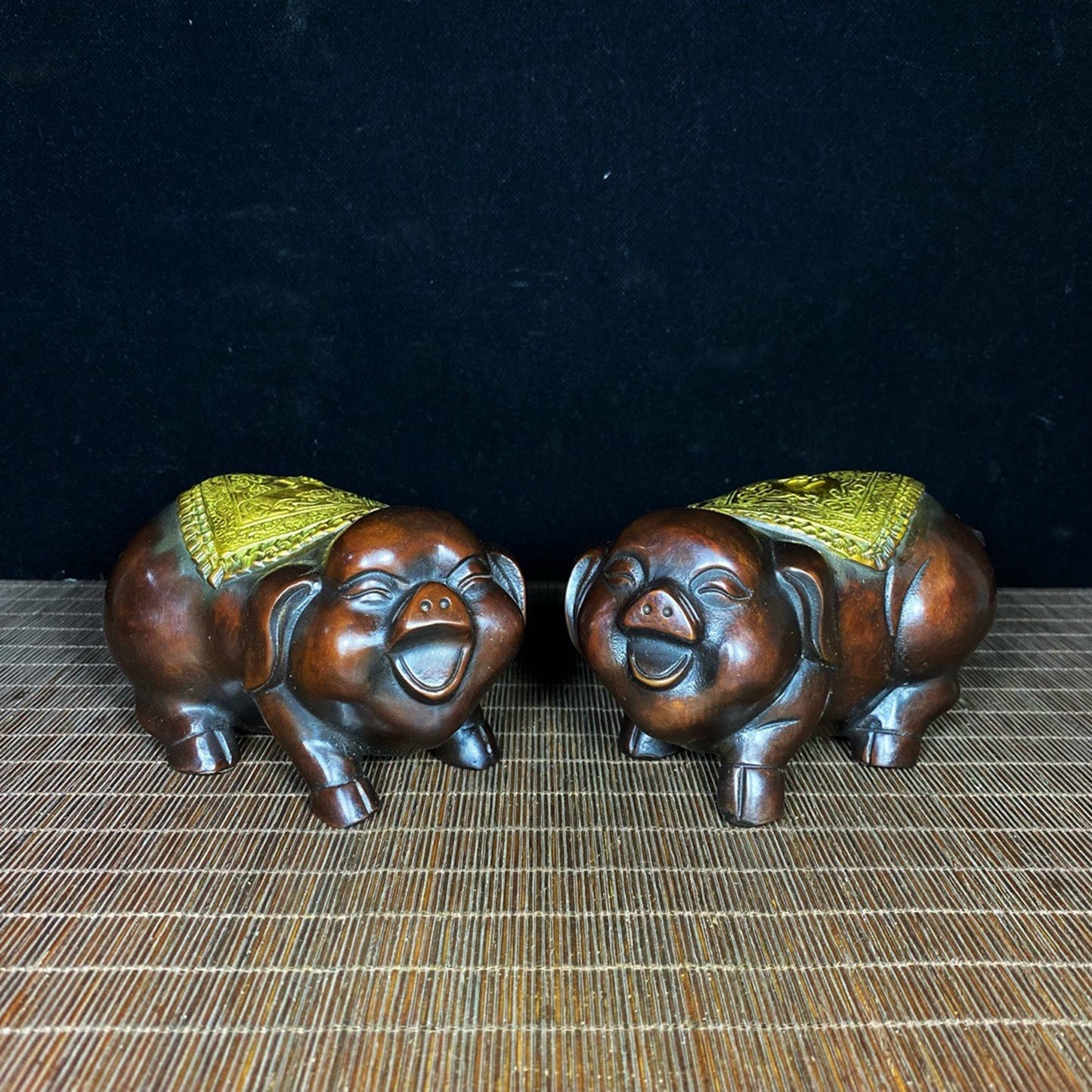 A pair of pure copper gilded and lucky little pigs