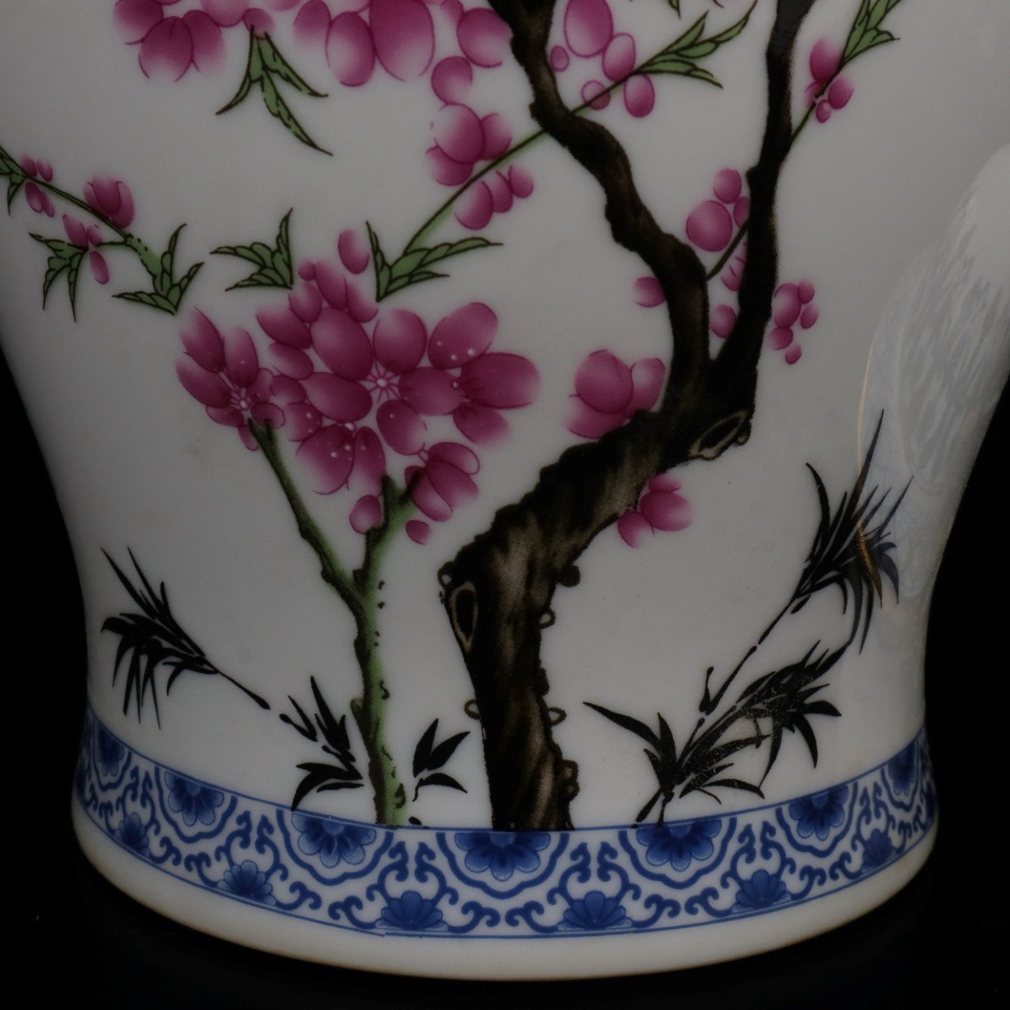 Blue and white jar with colorful bird songs and floral fragrance patterns