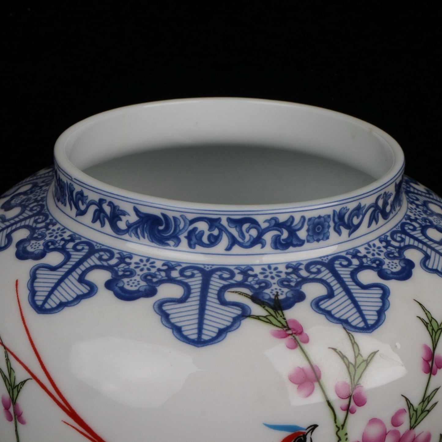Blue and white jar with colorful bird songs and floral fragrance patterns