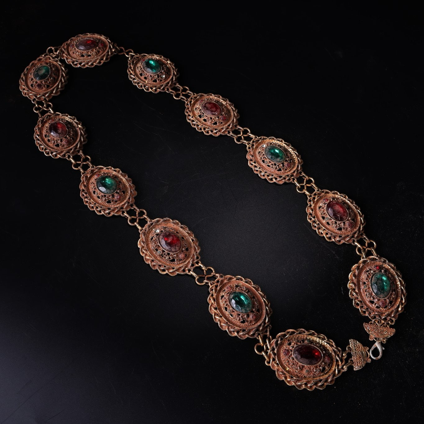 A Chinese antique bronze gilded gemstone inlaid belt