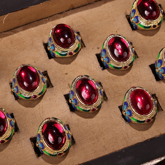 A box of rare and exquisite red gemstone and diamond rings set with Chinese antique gilded gold inlay