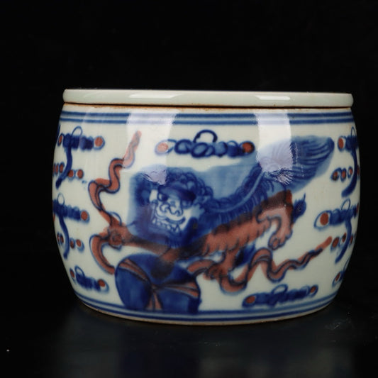 Blue and white glazed red lion rolling embroidered ball pattern cricket jar