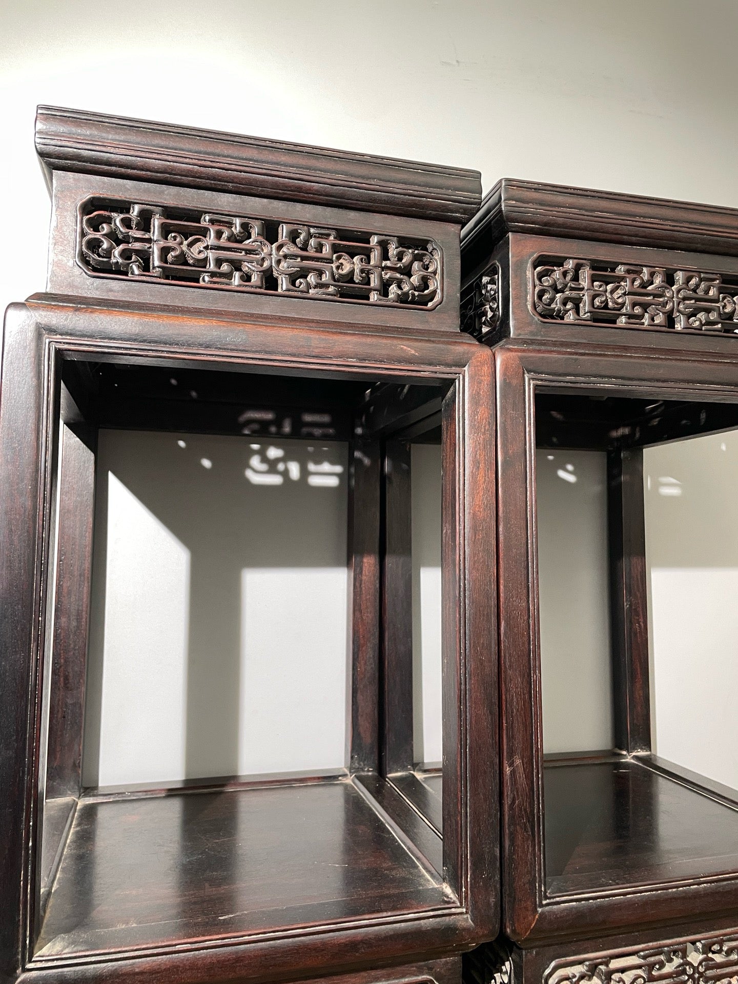 A pair of rosewood flowers