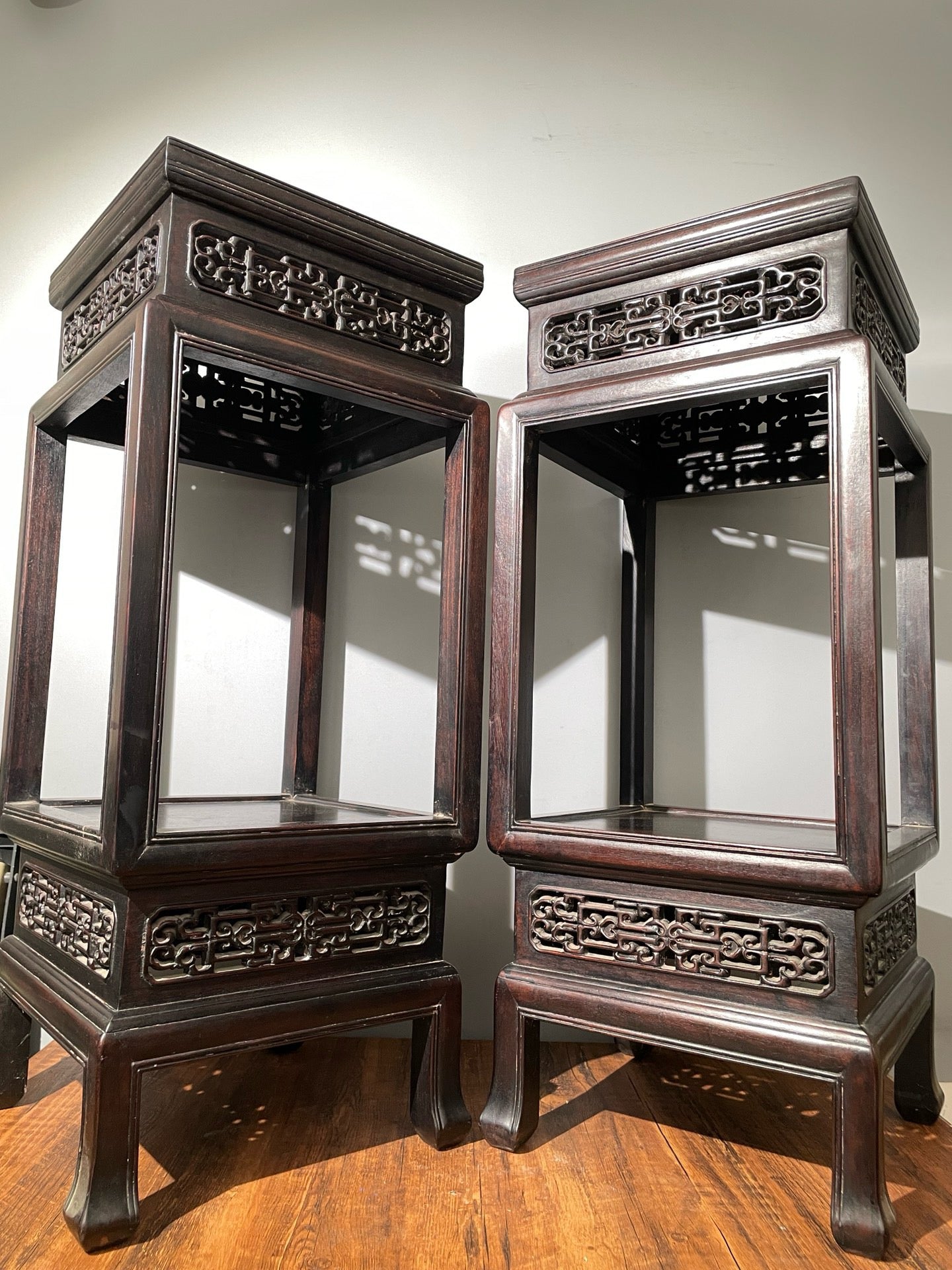 A pair of rosewood flowers