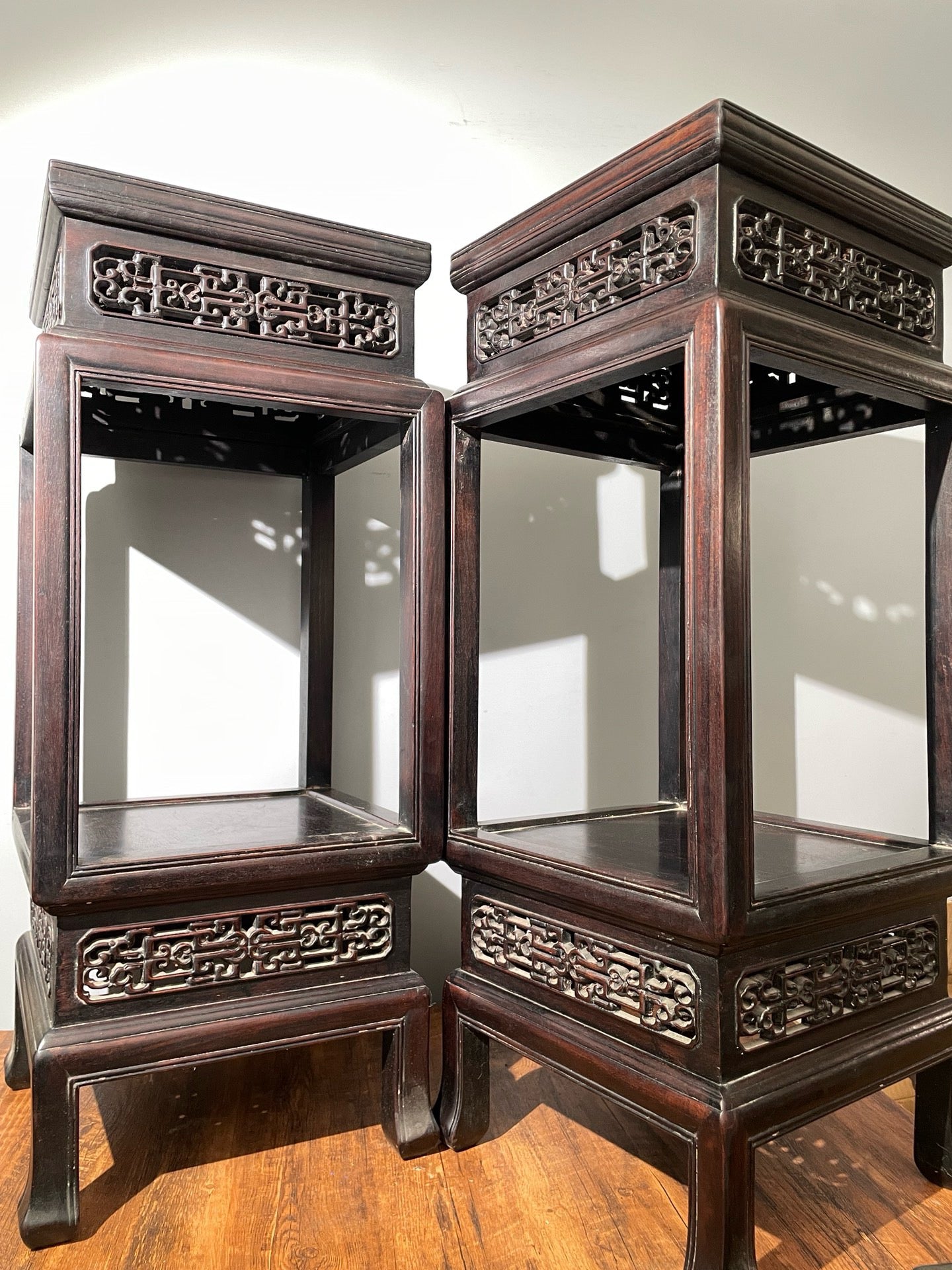 A pair of rosewood flowers