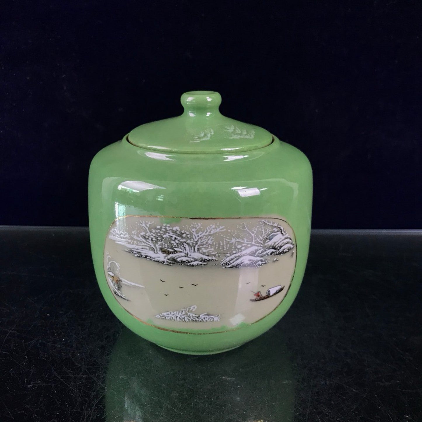 Green glazed open window jar with flower and bird pattern lid