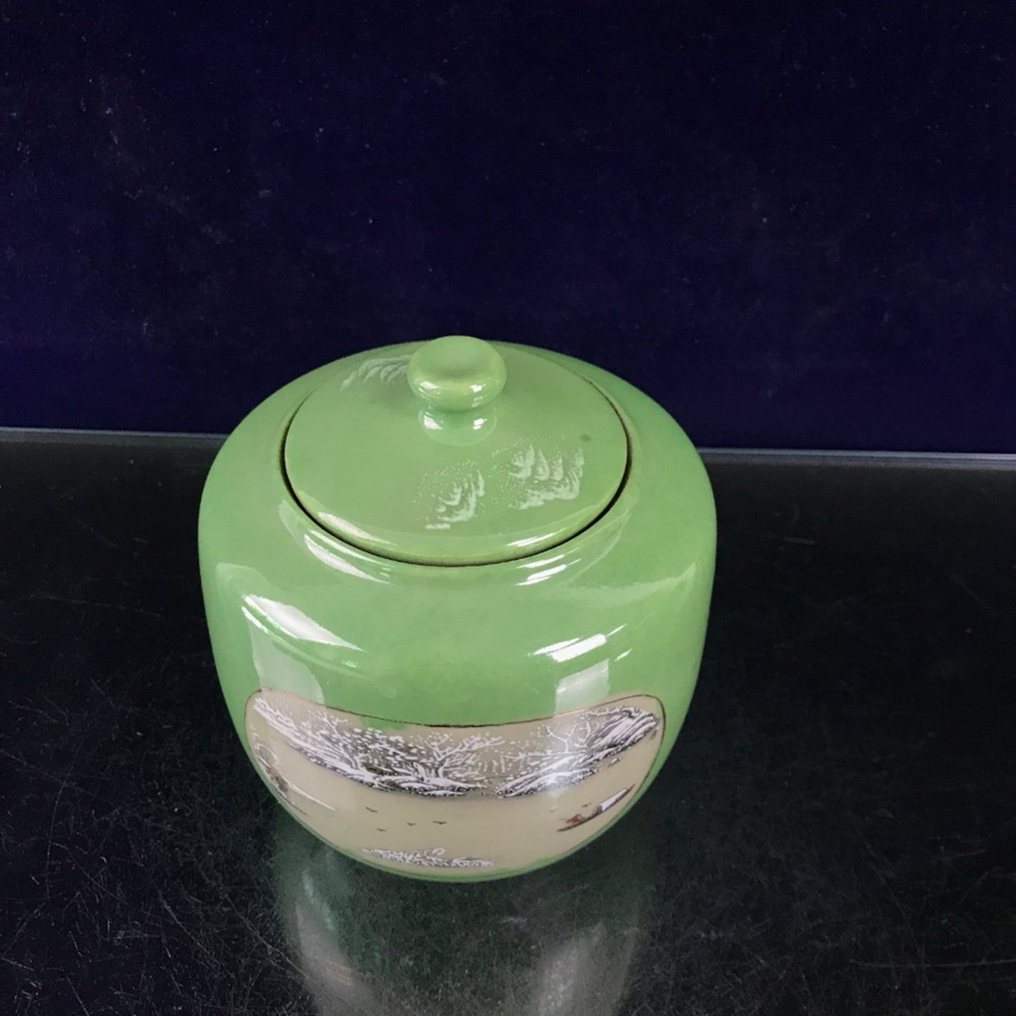 Green glazed open window jar with flower and bird pattern lid