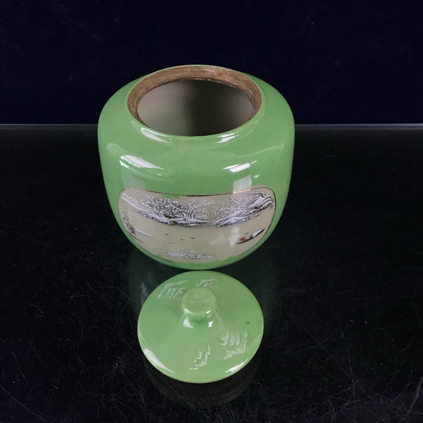 Green glazed open window jar with flower and bird pattern lid