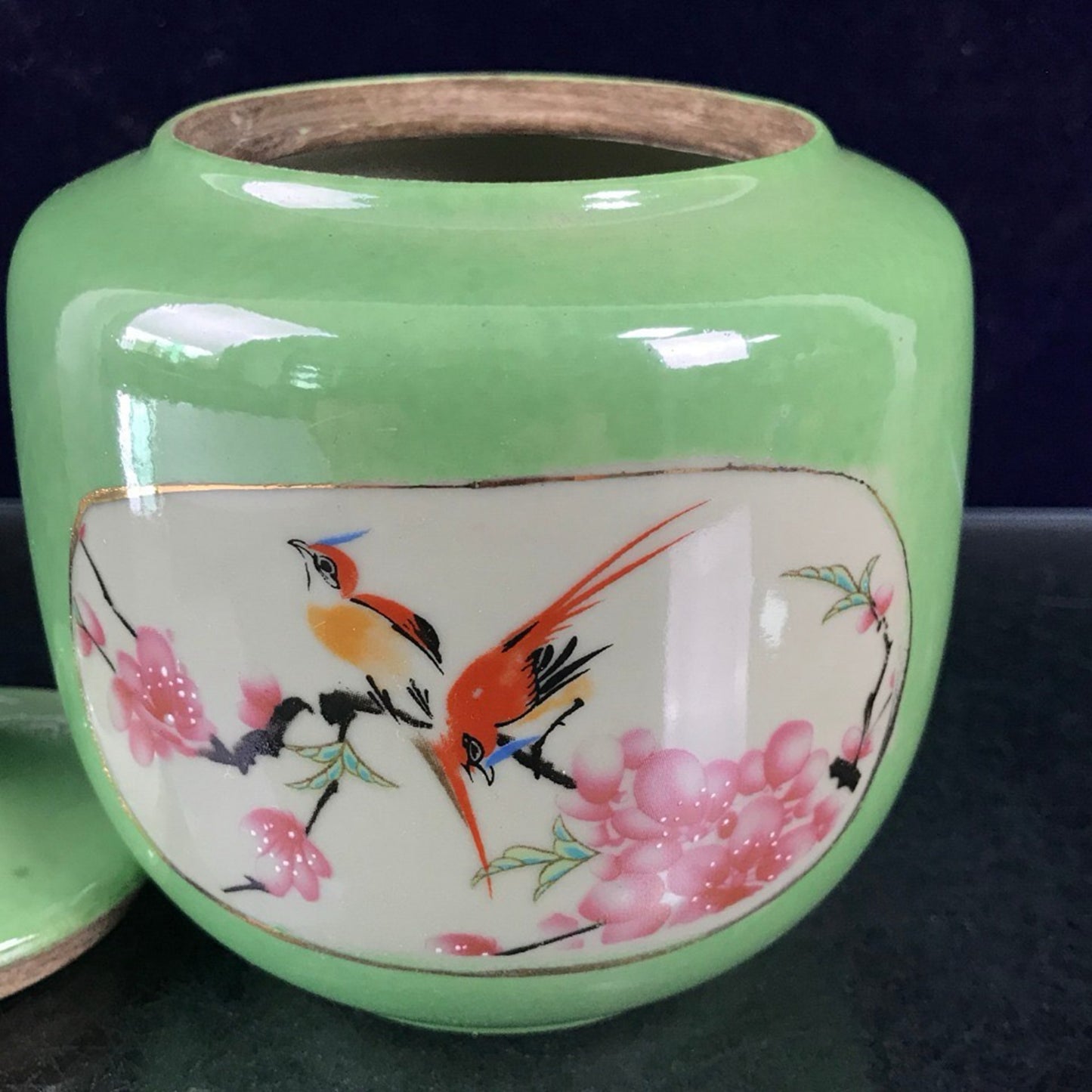 Green glazed open window jar with flower and bird pattern lid