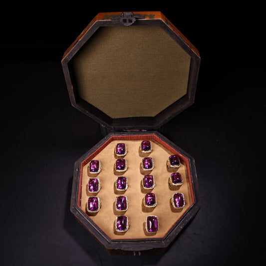 A box of Chinese antique purple gemstone rings