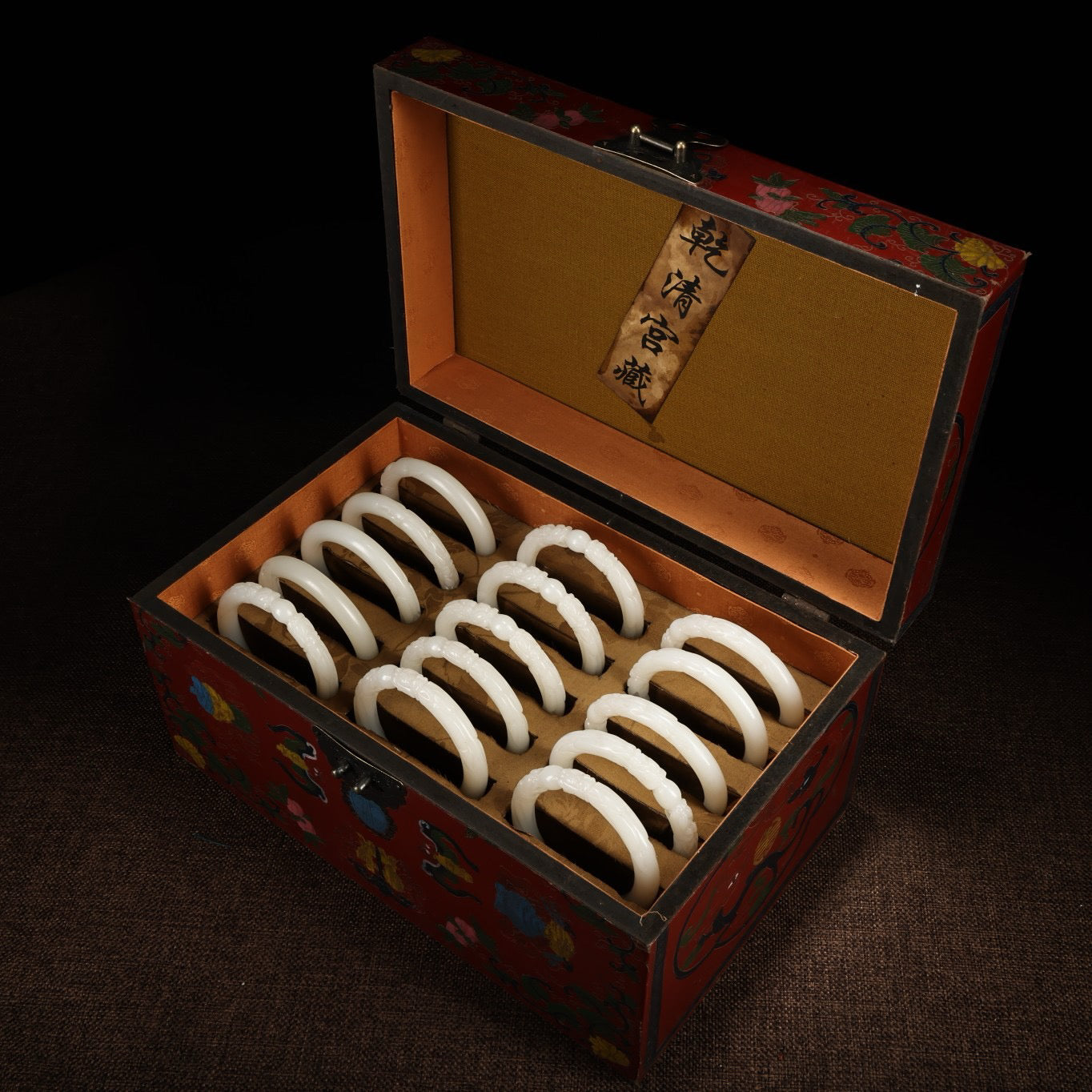 A box of Chinese antique dragon head white jade bracelets