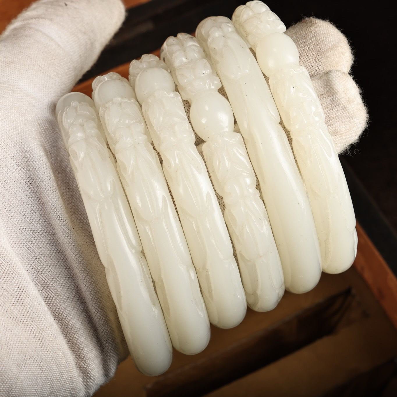 A box of Chinese antique dragon head white jade bracelets