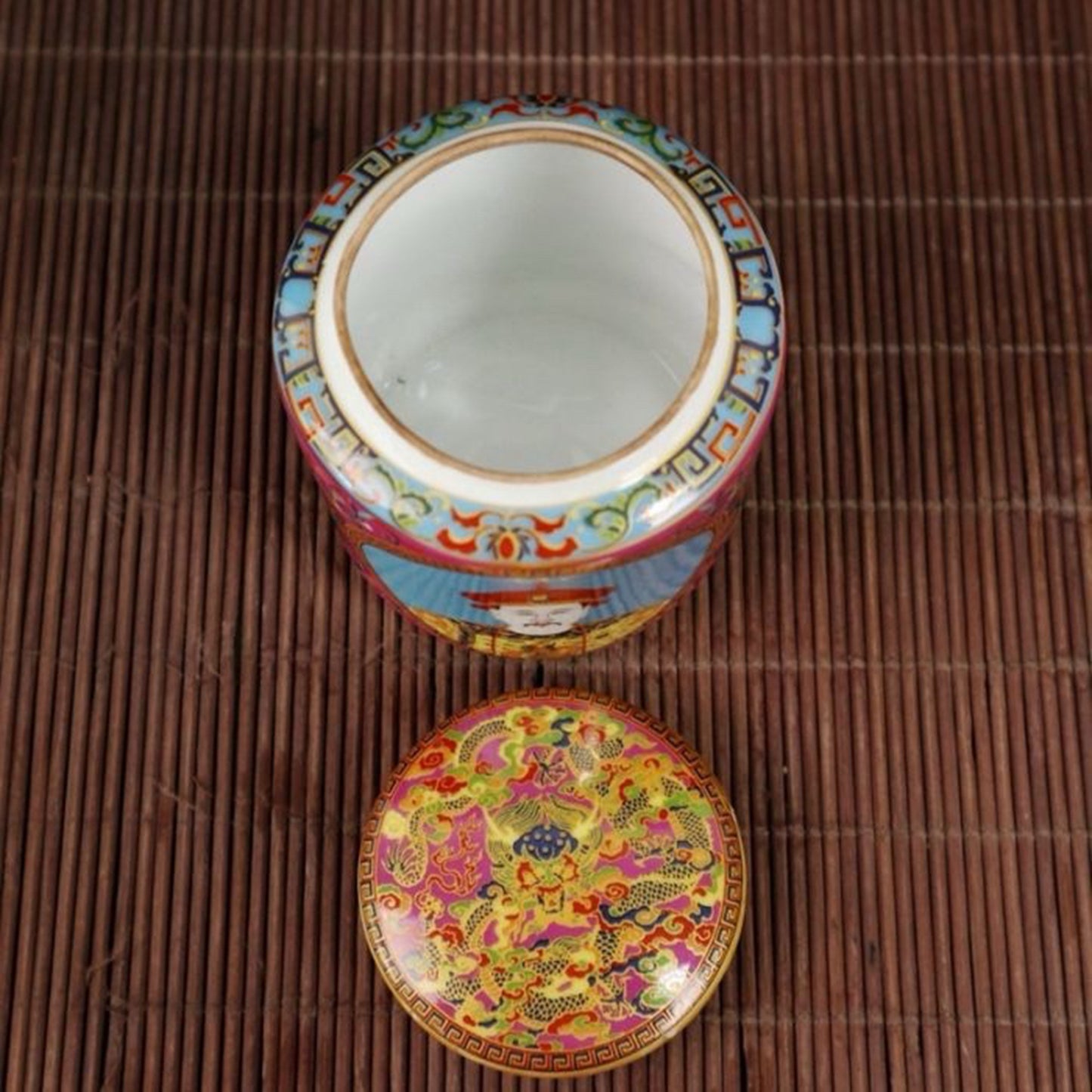 A pair of enamel colored figure patterned lid jars