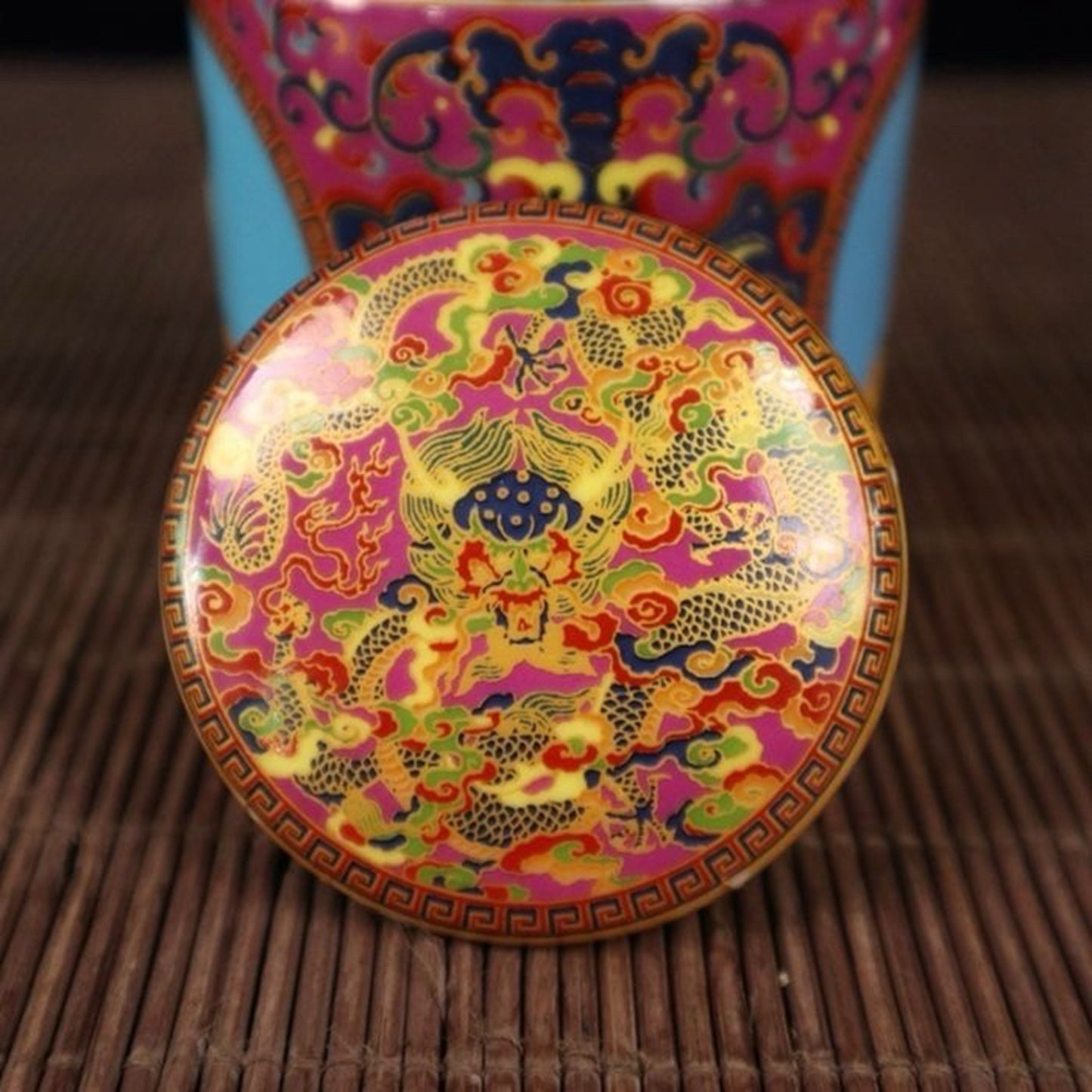 A pair of enamel colored figure patterned lid jars