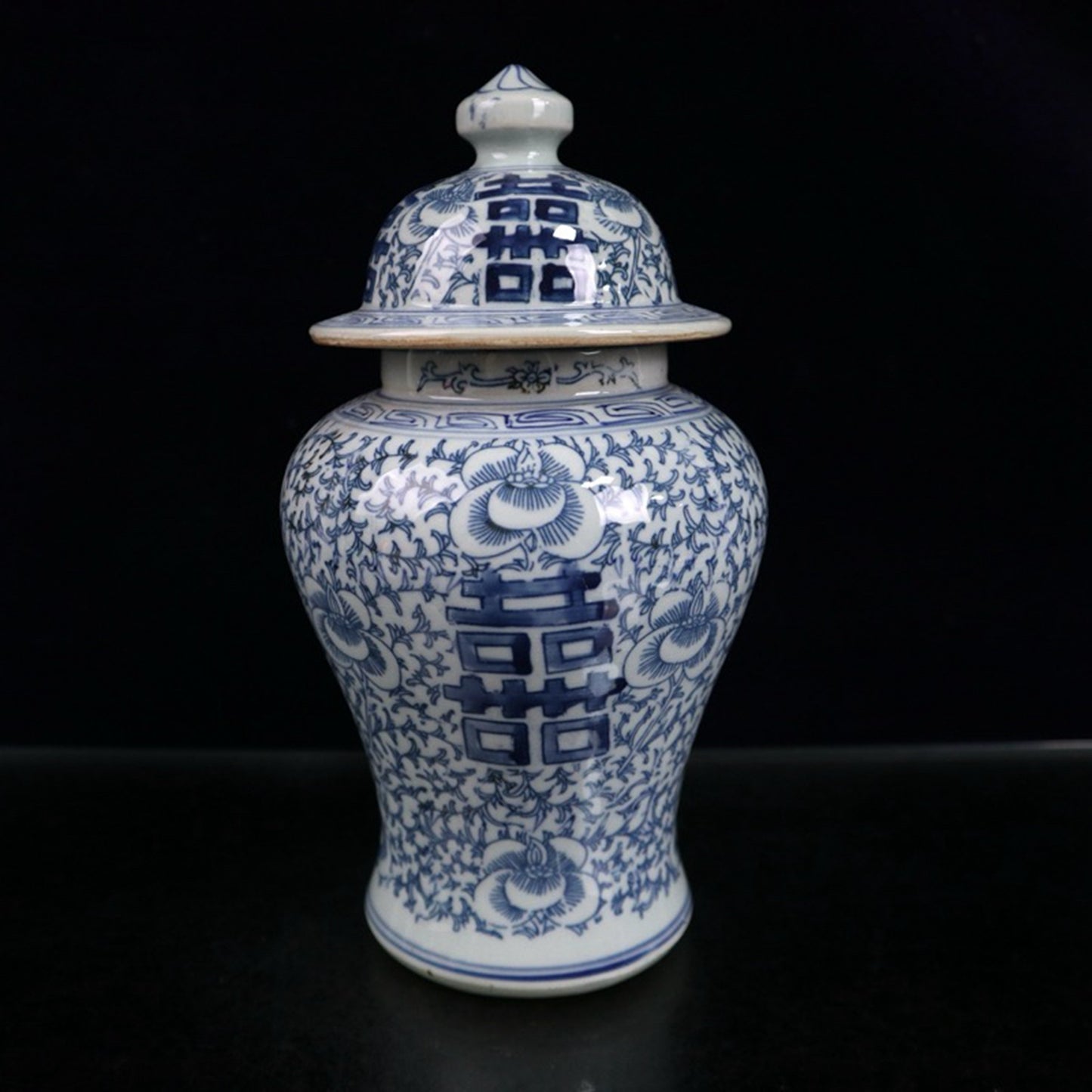 Blue and white double happiness entangled branch lotus pattern general jar