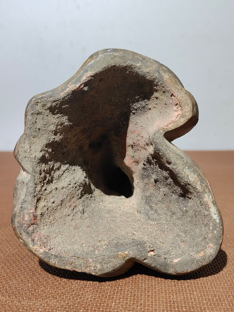 Buddha statue with old copper body, mud and gold, blooming and scattering cinnabar