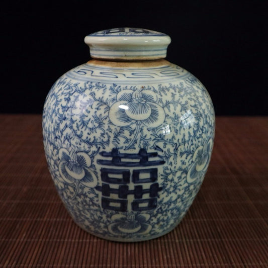 Blue and white lotus patterned happiness shaped jar