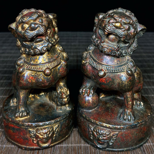 A pair of old copper tire mud gold drum face lions