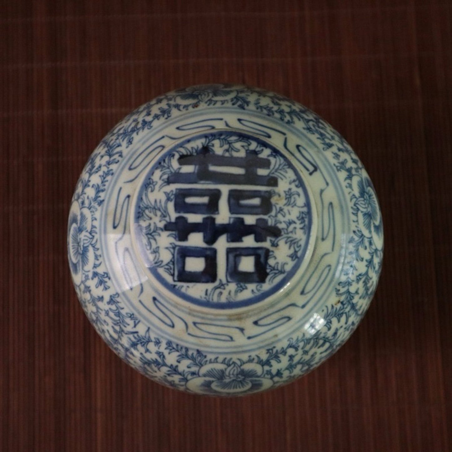 Blue and white lotus patterned happiness shaped jar