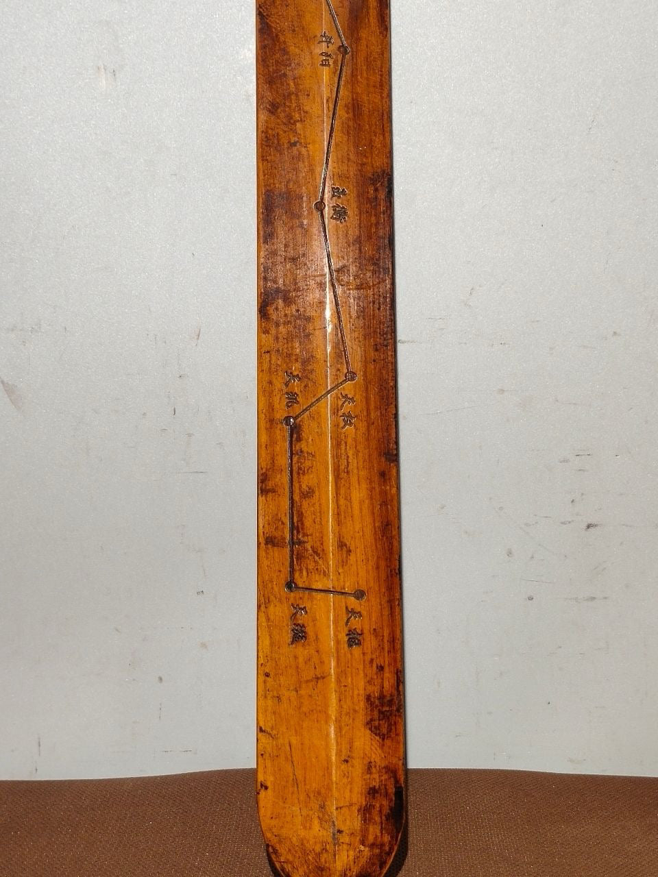 A solid wood carved sword