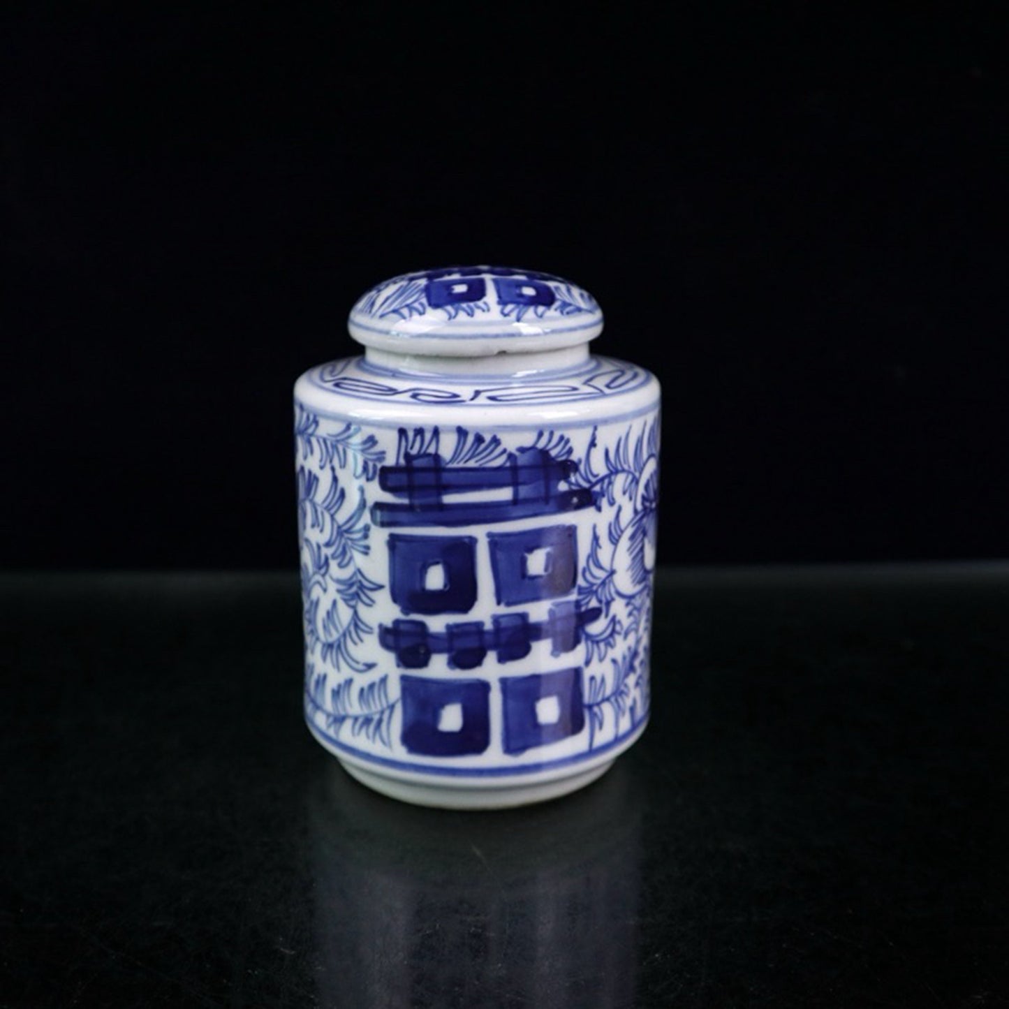 Blue and white double happiness entangled branch lotus pattern covered jar