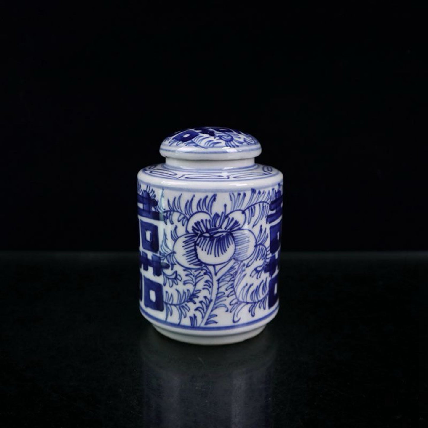 Blue and white double happiness entangled branch lotus pattern covered jar