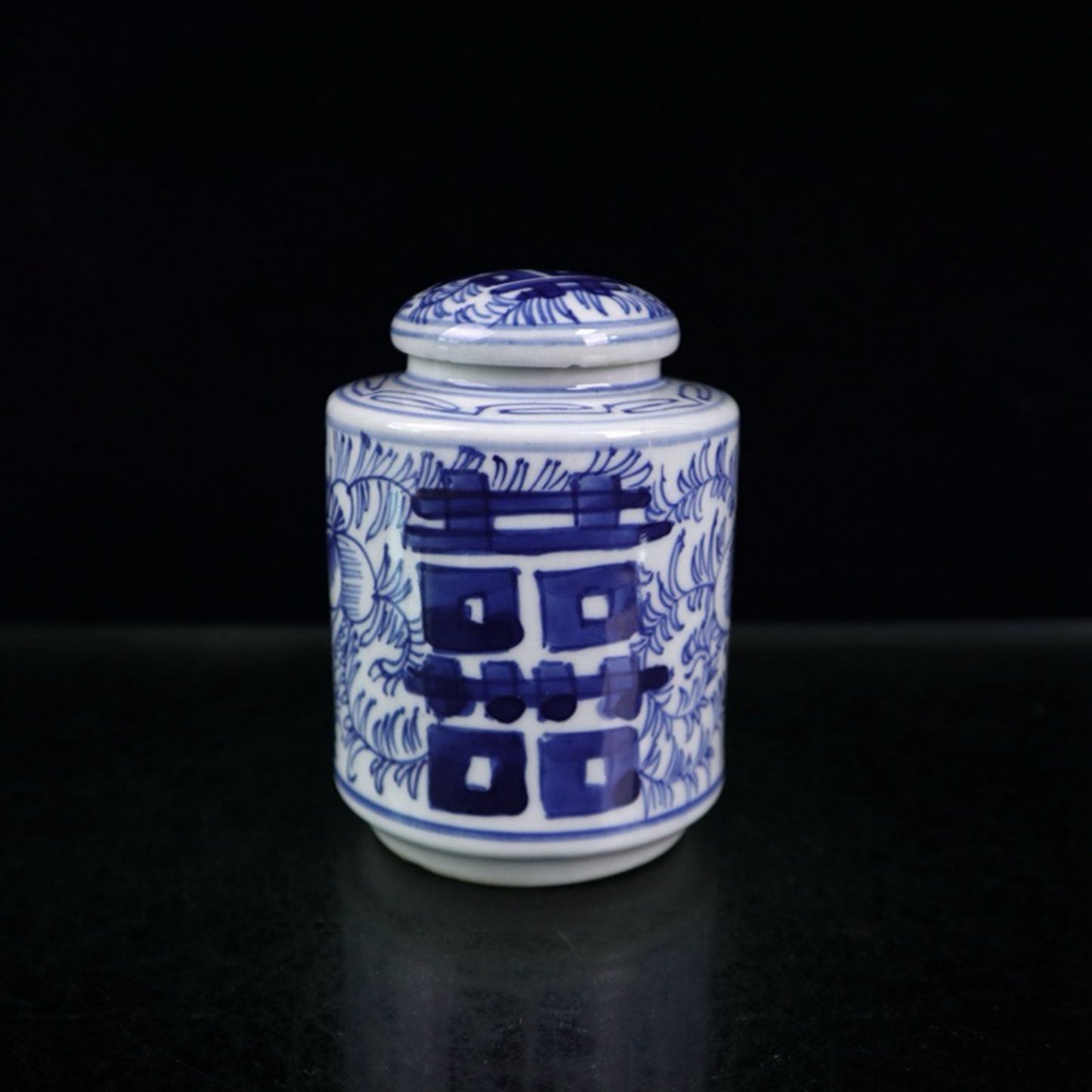 Blue and white double happiness entangled branch lotus pattern covered jar