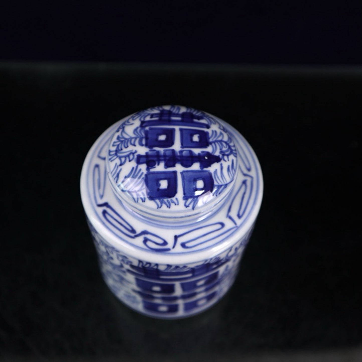 Blue and white double happiness entangled branch lotus pattern covered jar