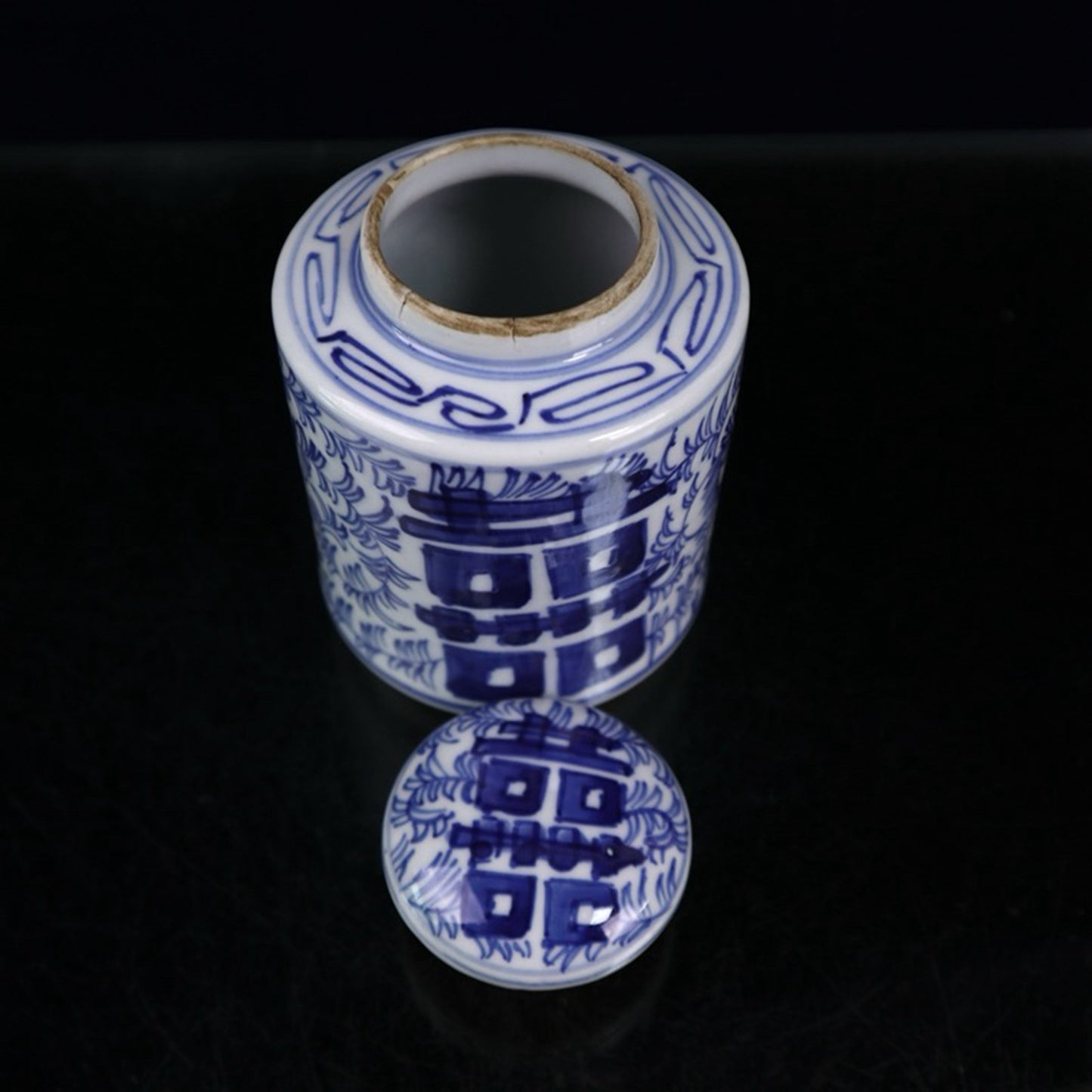 Blue and white double happiness entangled branch lotus pattern covered jar