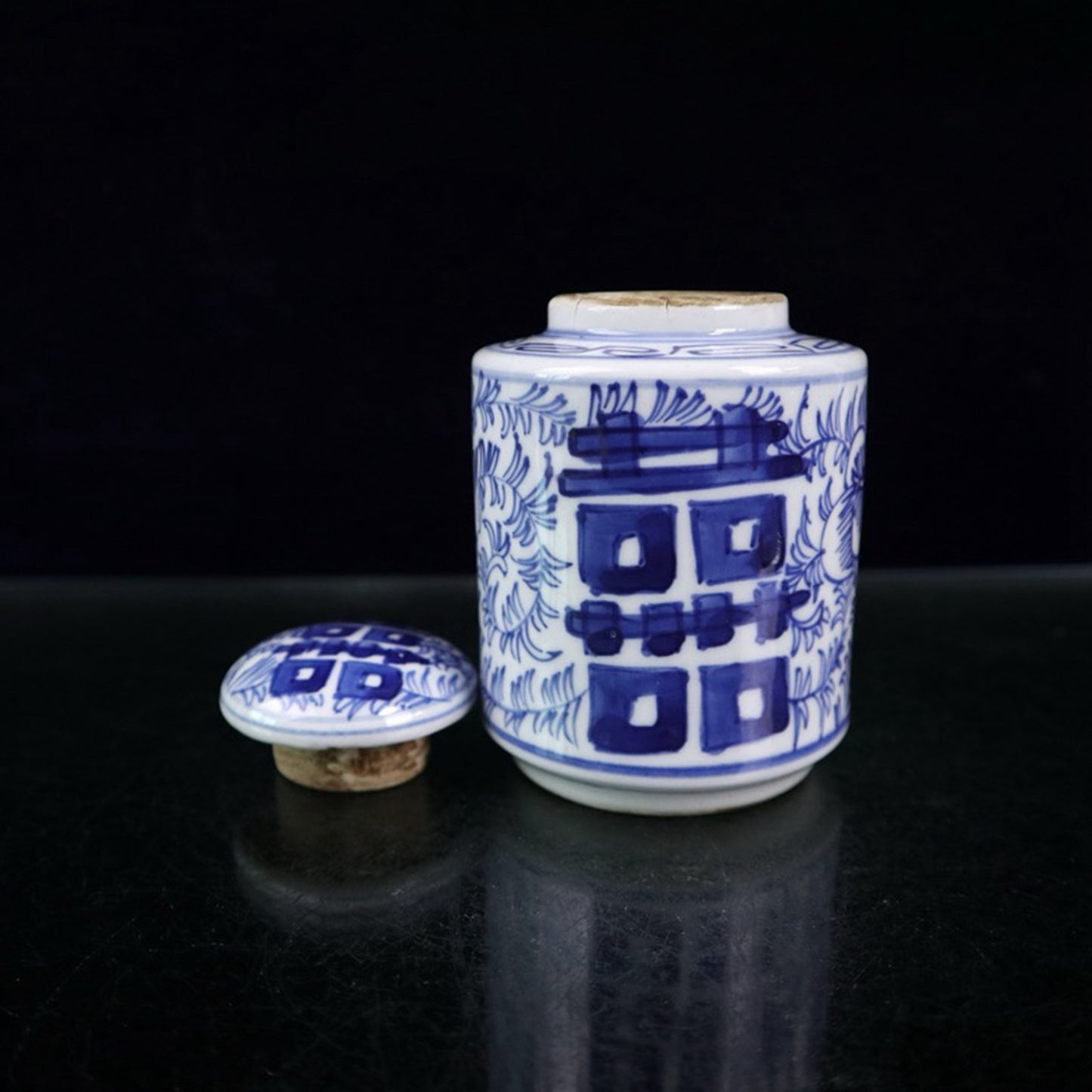 Blue and white double happiness entangled branch lotus pattern covered jar