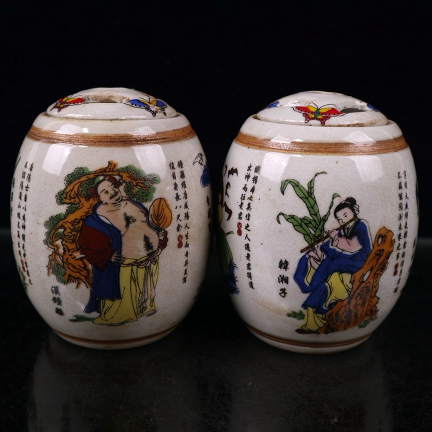 A pair of ceramic open panel pink Eight Immortals patterned waist drum lid jars