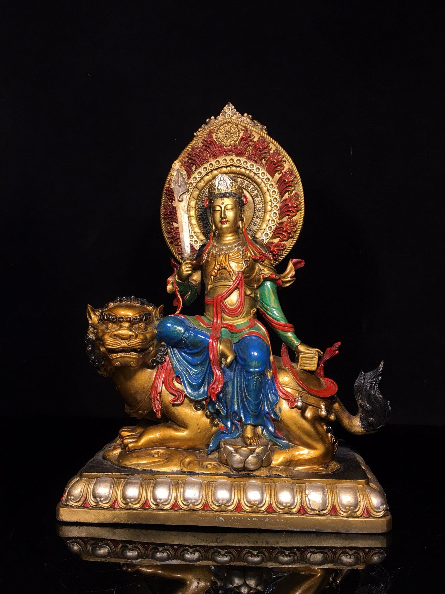 A pair of Chinese antique painted Manjushri Bodhisattva statues