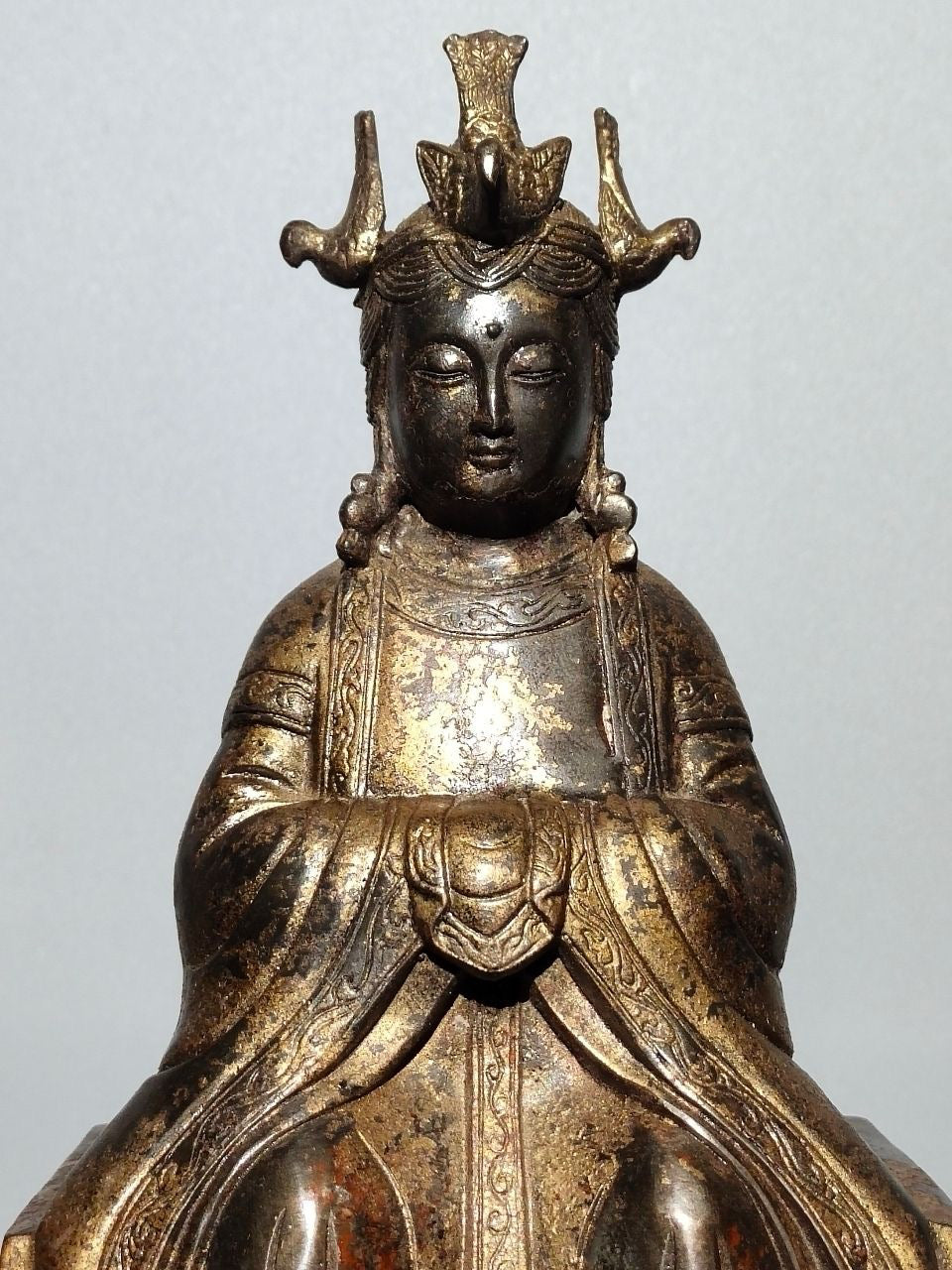 A statue of Mazu, a Buddha statue made of old copper, mud, gold, blooming, and sprinkled with cinnabar