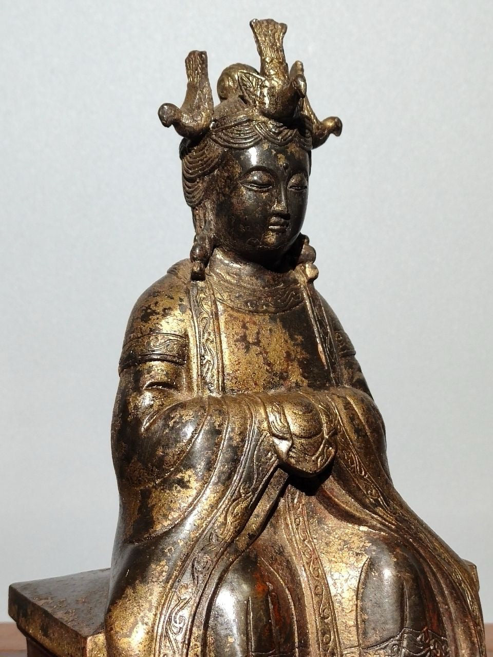 A statue of Mazu, a Buddha statue made of old copper, mud, gold, blooming, and sprinkled with cinnabar