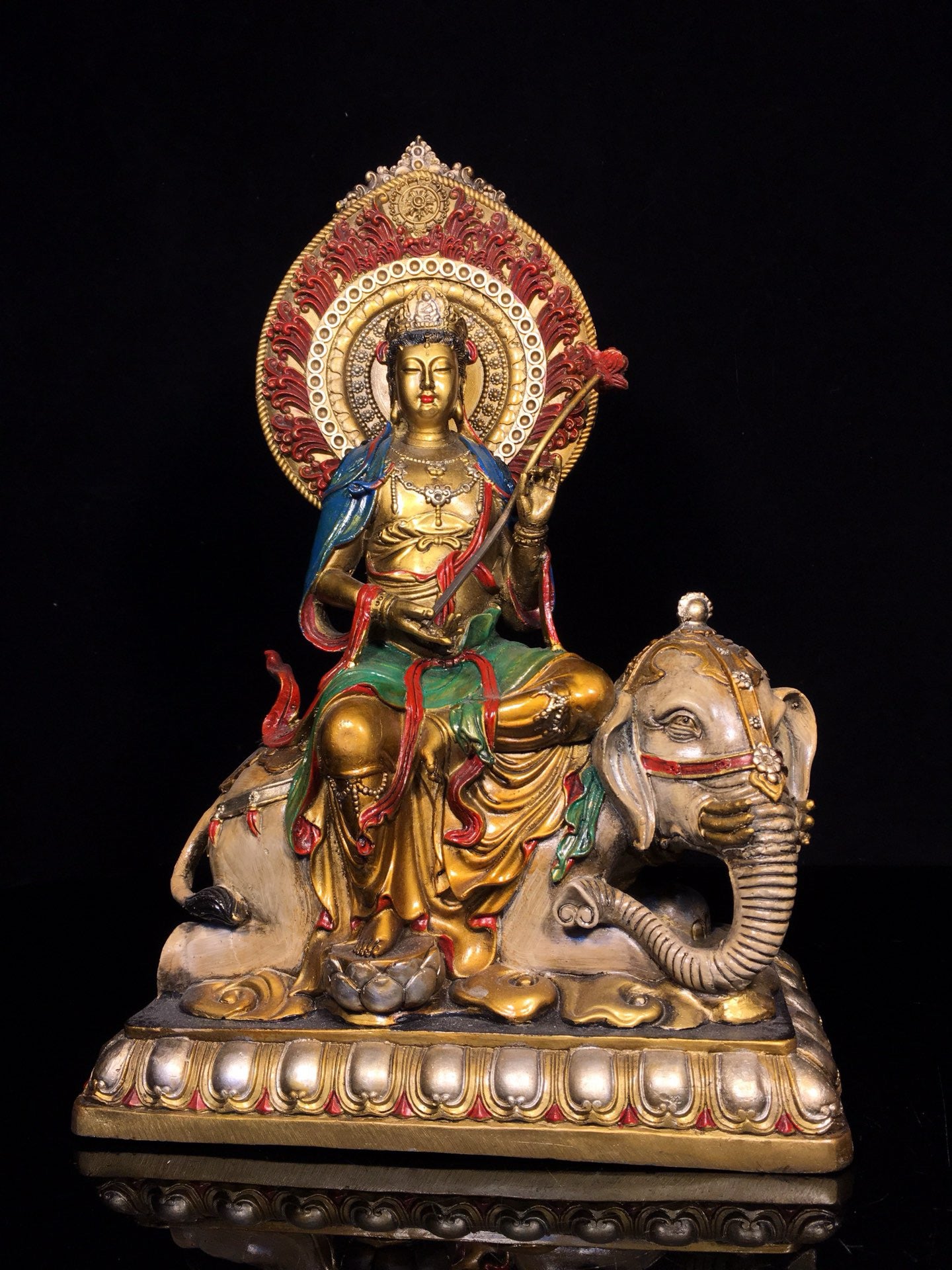 A pair of Chinese antique painted Manjushri Bodhisattva statues