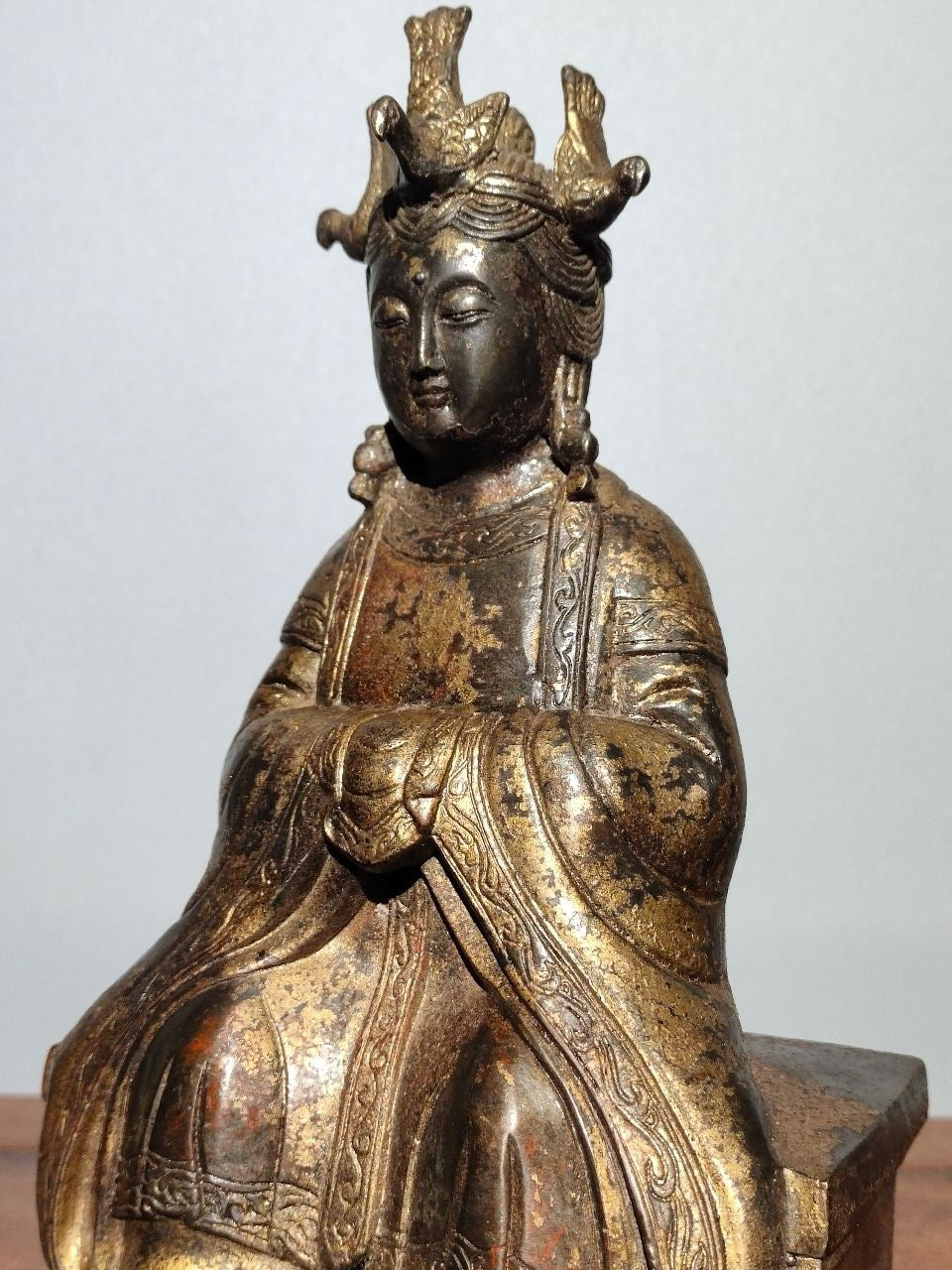A statue of Mazu, a Buddha statue made of old copper, mud, gold, blooming, and sprinkled with cinnabar