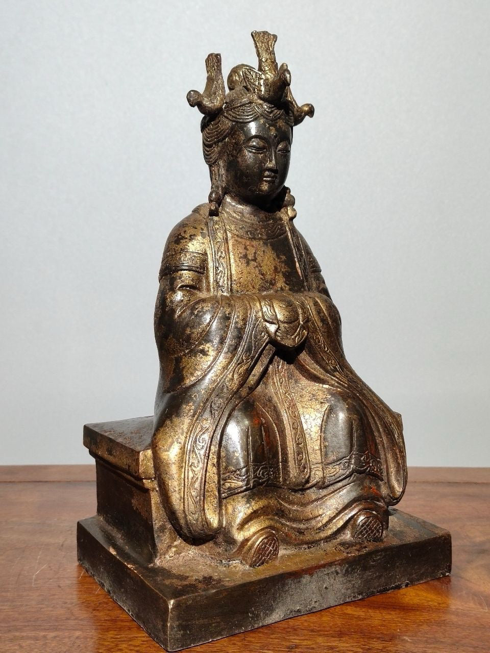 A statue of Mazu, a Buddha statue made of old copper, mud, gold, blooming, and sprinkled with cinnabar