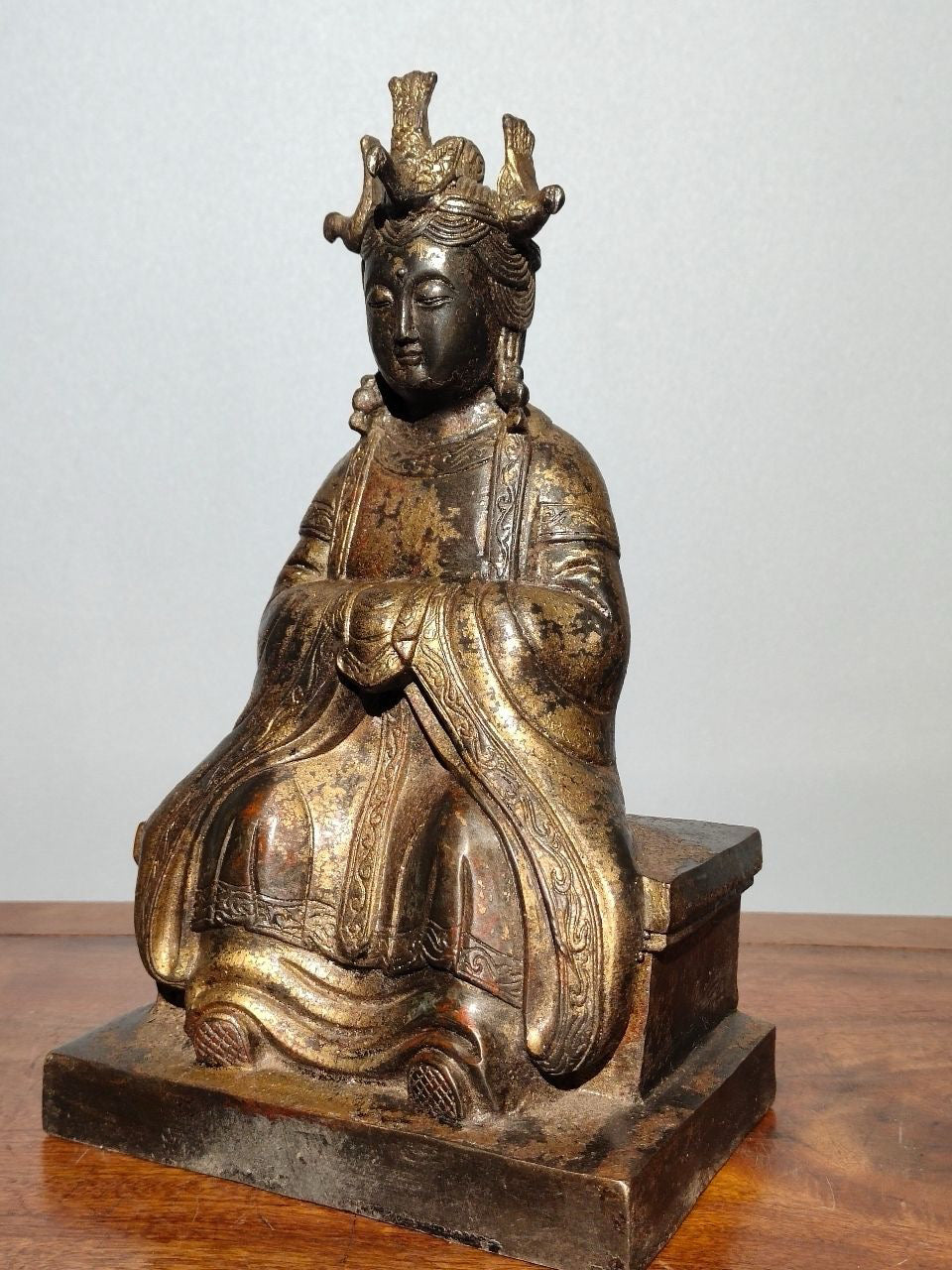 A statue of Mazu, a Buddha statue made of old copper, mud, gold, blooming, and sprinkled with cinnabar
