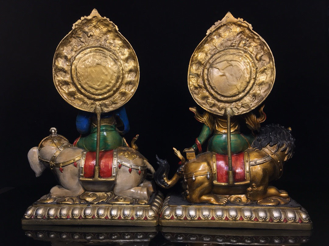 A pair of Chinese antique painted Manjushri Bodhisattva statues