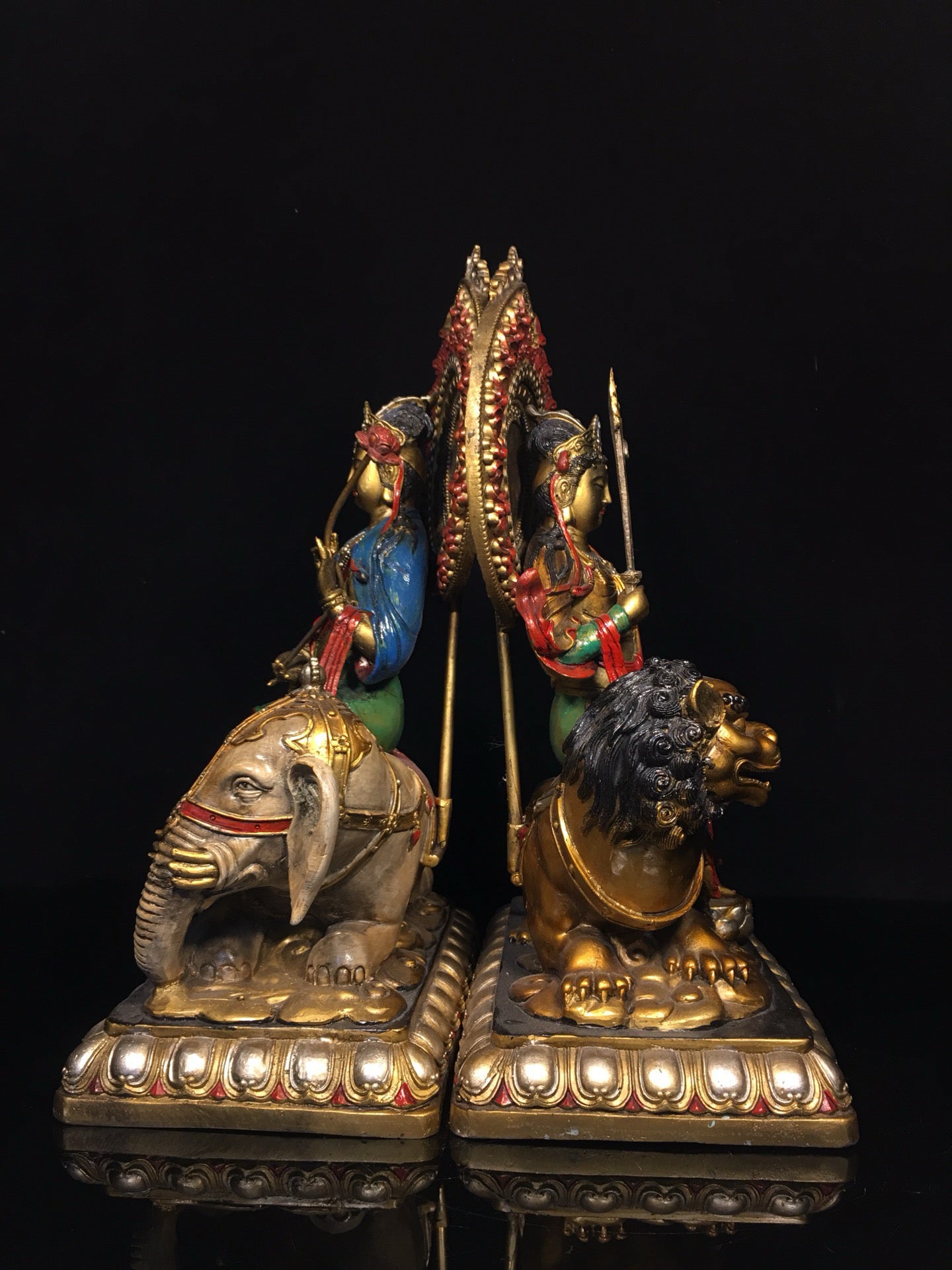 A pair of Chinese antique painted Manjushri Bodhisattva statues