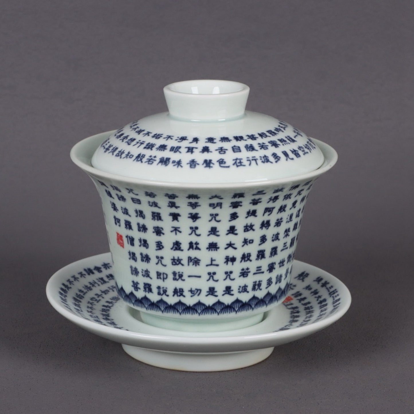 A pair of ceramic blue and white glazed covered bowls