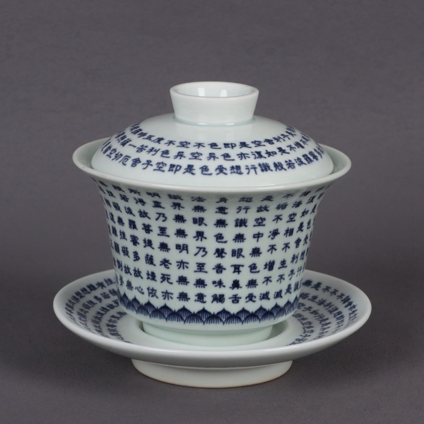 A pair of ceramic blue and white glazed covered bowls