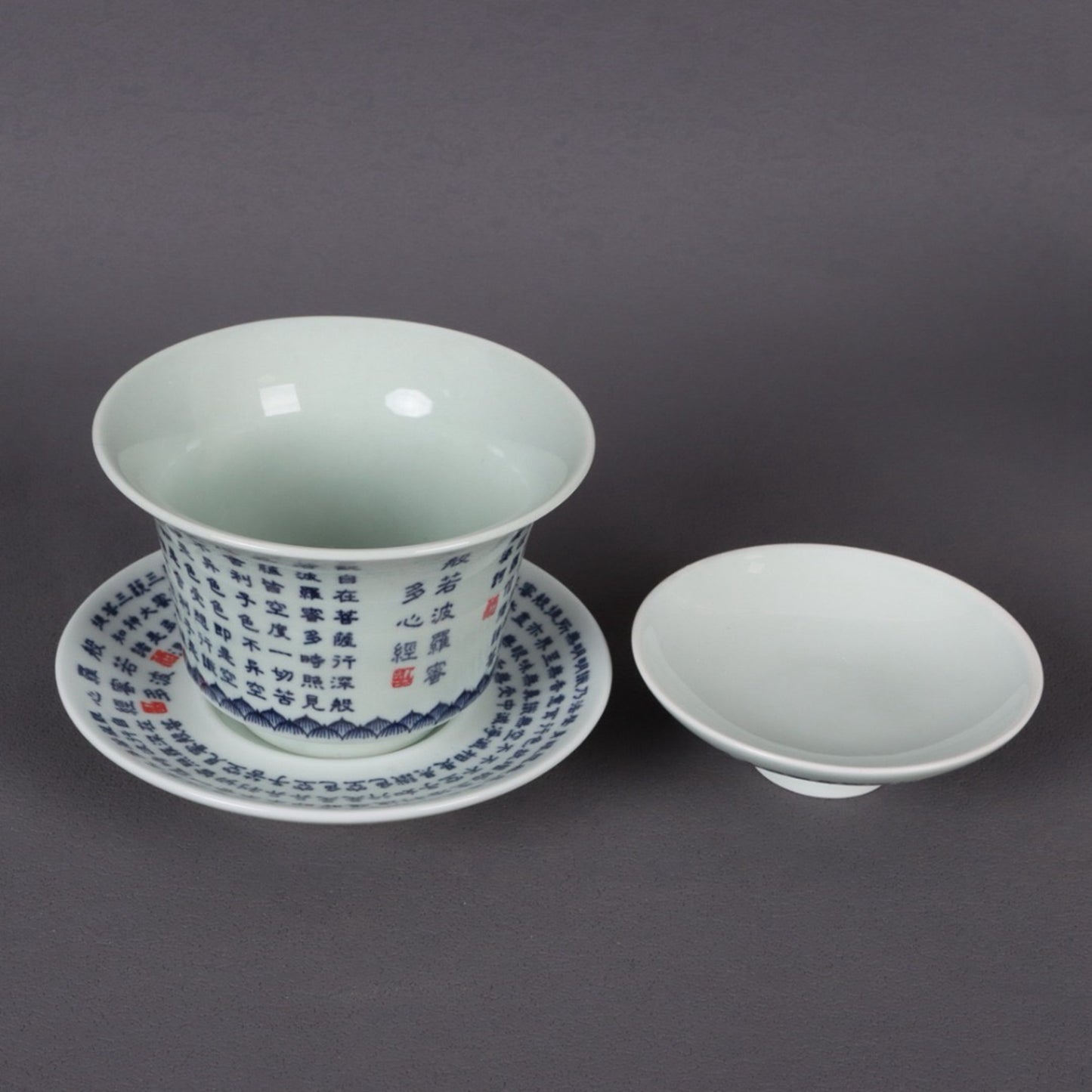 A pair of ceramic blue and white glazed covered bowls