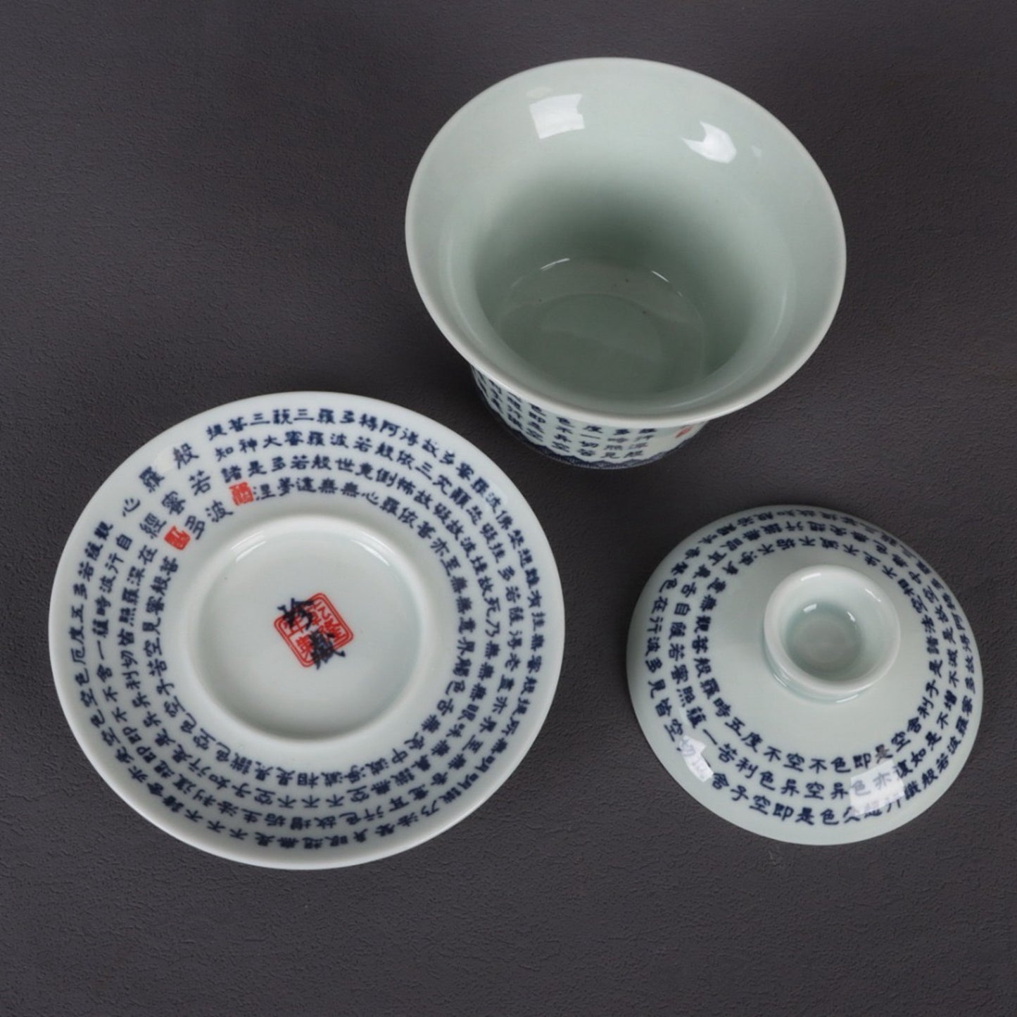 A pair of ceramic blue and white glazed covered bowls