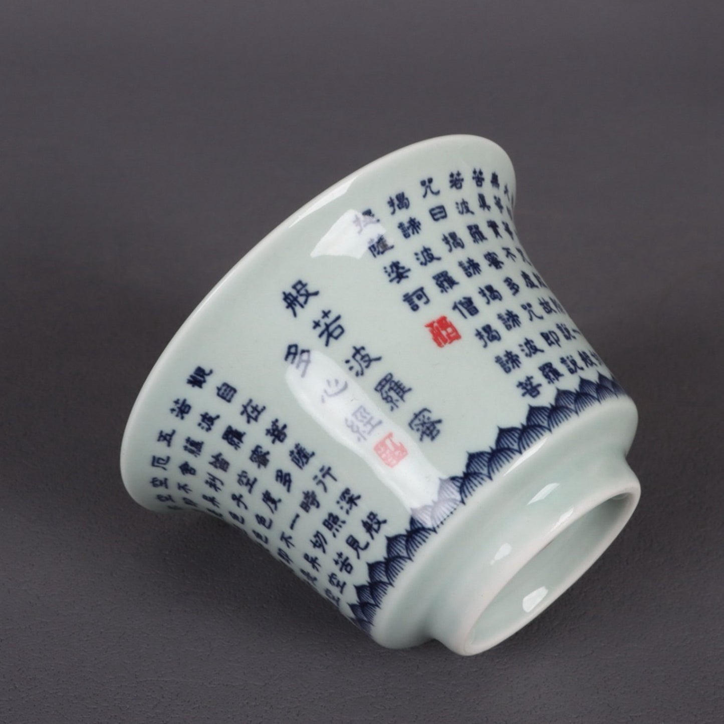 A pair of ceramic blue and white glazed covered bowls