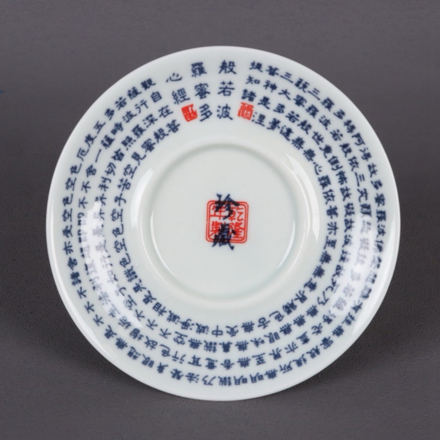 A pair of ceramic blue and white glazed covered bowls