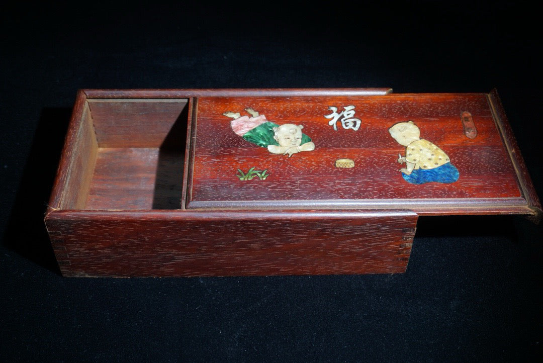 Pear wood inlaid shell shaped lucky push-pull box in front of me
