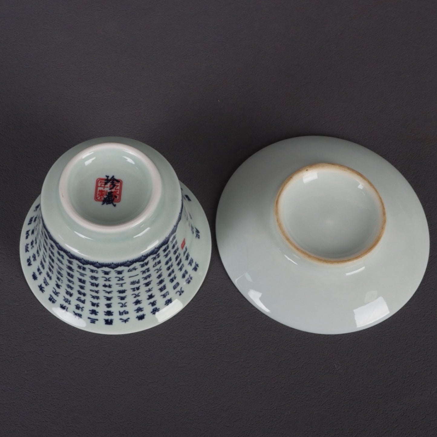 A pair of ceramic blue and white glazed covered bowls