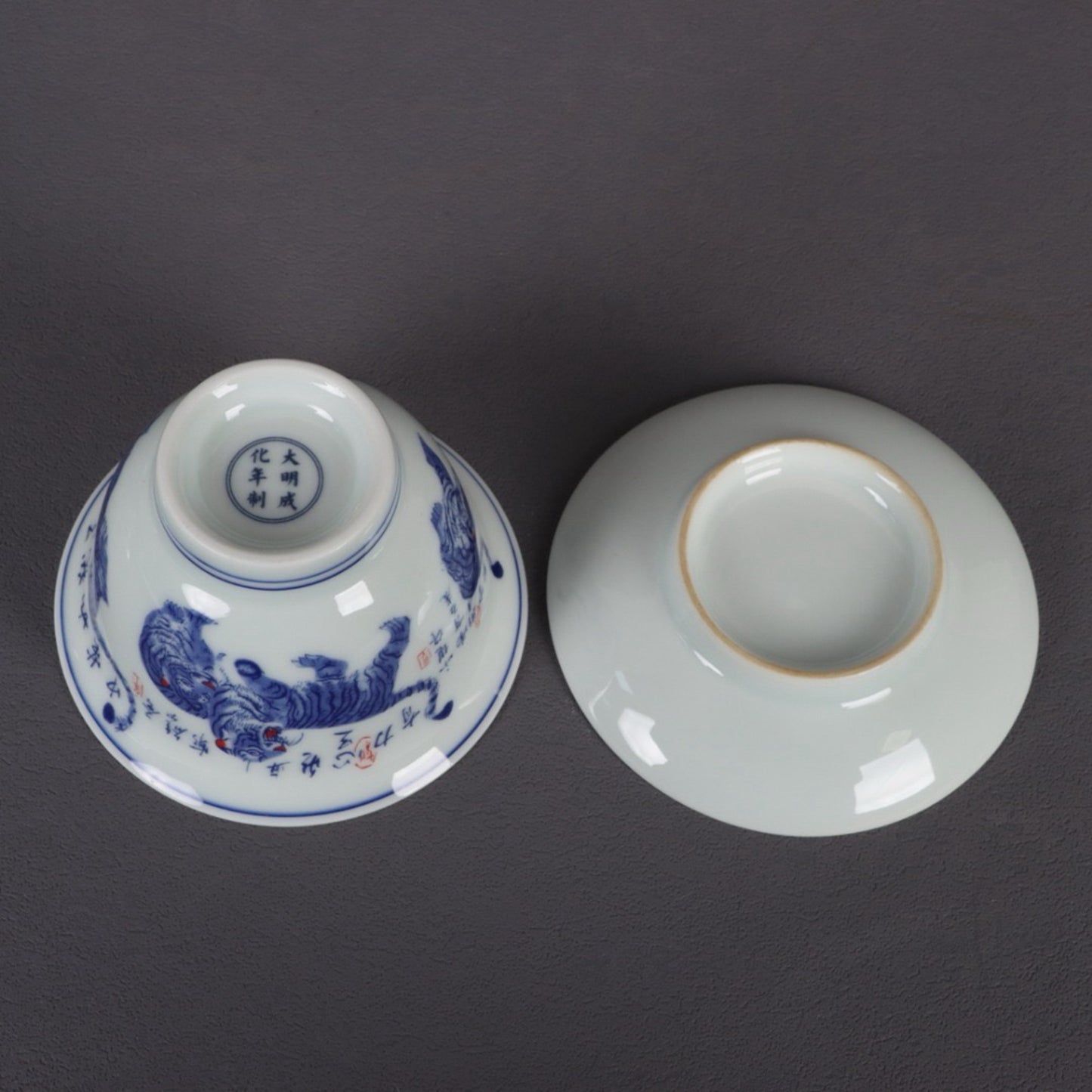 A pair of ceramic blue and white glazed covered bowls